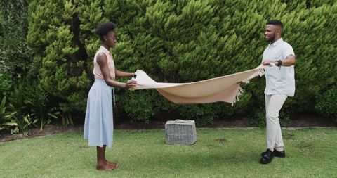 African American Couple Enjoying Leisure Time in Garden