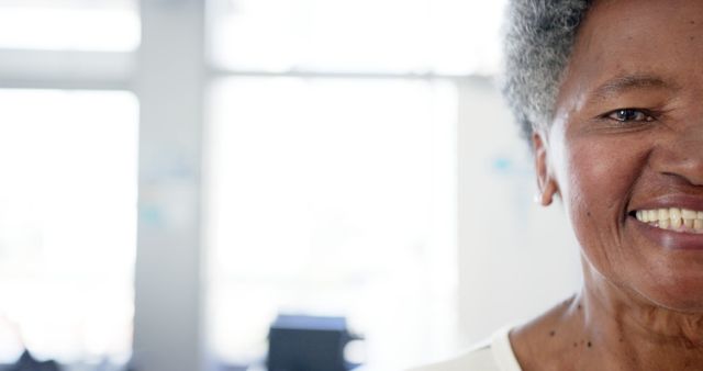 Senior African American Woman Smiling in Bright Room - Download Free Stock Images Pikwizard.com