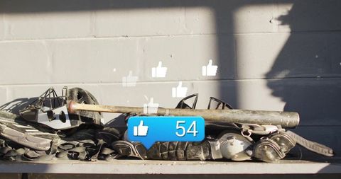 Baseball gear with notification icons on bench indicates online engagement