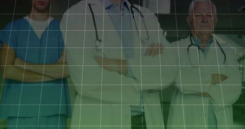 Confident medical team in hospital corridor with stethoscopes