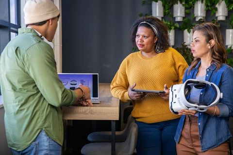 Collaborating on vr prototype: diverse team discussing headset design and ux strategy