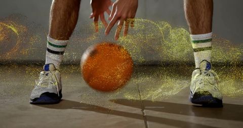 Basketball Dribbling Action with Golden Particles Overlay - Download Free Stock Images Pikwizard.com