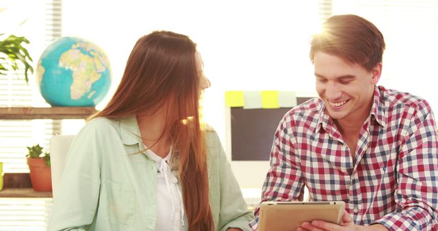 Cheerful Colleagues Collaborating on Digital Tablet in Office - Download Free Stock Images Pikwizard.com