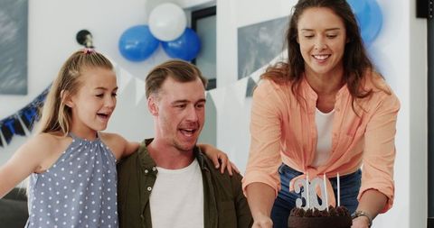 Family Celebrating Father's 30th Birthday Joyfully