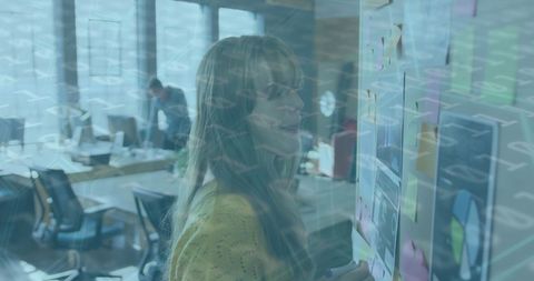 Woman collaborating on mood board in modern office