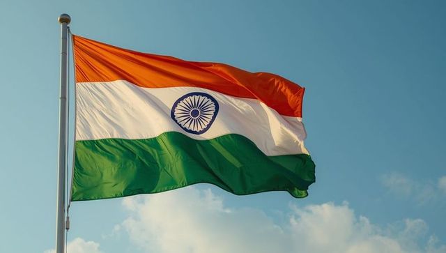 Indian flag fluttering against clear blue sky