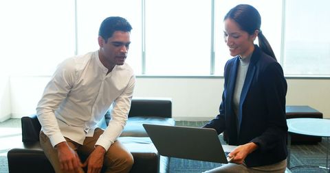 Professional Business Colleagues Collaborating in Office Environment