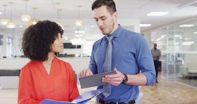 Two Colleagues Discussing Work in Modern Office - Download Free Stock Images Pikwizard.com