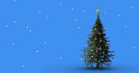 Snow Gently Falling on Decorated Christmas Tree - Download Free Stock Images Pikwizard.com