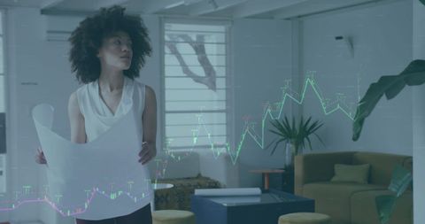 Businesswoman Analyzing Financial Data with Virtual Graphs