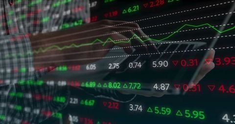 Analyzing stock market data on tablet, man tapping screen with glowing charts and figures