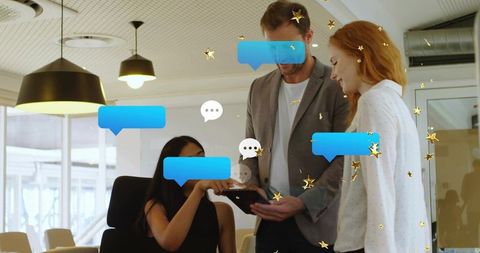 Colleagues collaborating over tablet with chat overlays and gold stars in modern office