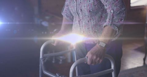 Senior Woman Using Walking Frame with Inspirational Light