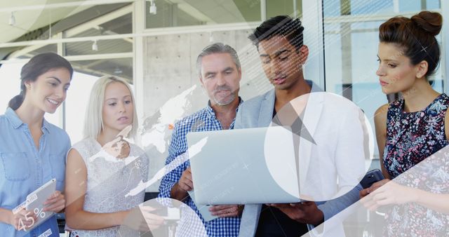 Diverse Team Collaborating on Business Project with Laptop and Digital Data Overlay - Download Free Stock Images Pikwizard.com