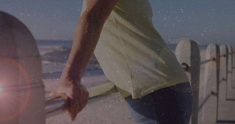 Woman Enjoying Ocean Breeze at Scenic Beachfront