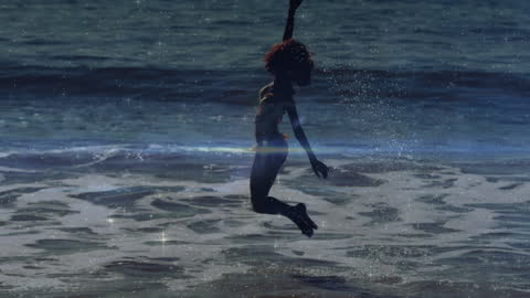 Dynamic Silhouette of Woman Enjoying Beach Day