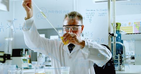 Male Scientist Analyzing in Laboratory with Formula Projections - Download Free Stock Images Pikwizard.com