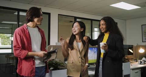 Diverse Team Engaging in Open Office Collaboration