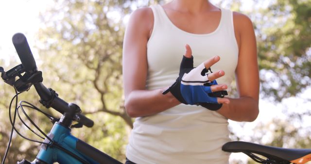 Cyclist wearing gloves for outdoor bike ride - Download Free Stock Images Pikwizard.com