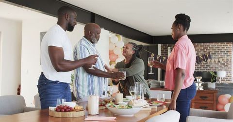 Happy Family Celebrating Retirement Together with Toast and Smiles