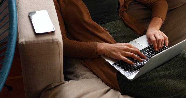 Person Relaxing on Sofa Typing on Laptop - Download Free Stock Images Pikwizard.com