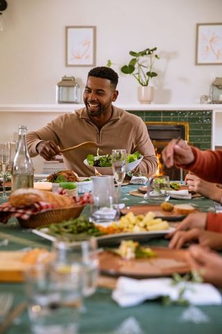 Festive Gathering around Table Enjoying Meal and Laughter