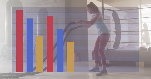 Health trends with active female athlete battling exercise ropes