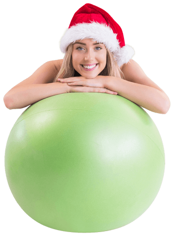 Smiling Woman with Santa Hat and Green Exercise Ball on Transparent Background