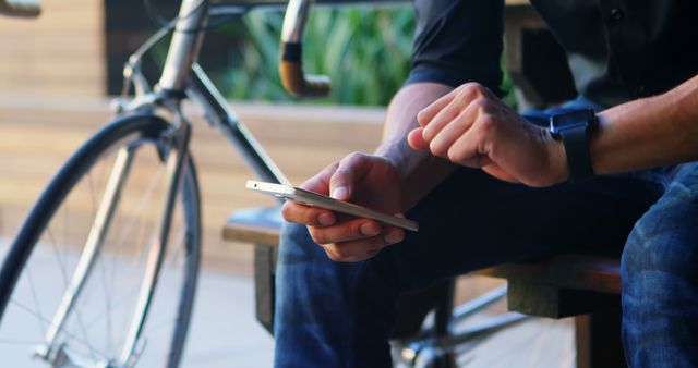 Casual Professional Checking Smartwatch and Smartphone Outdoors - Download Free Stock Images Pikwizard.com