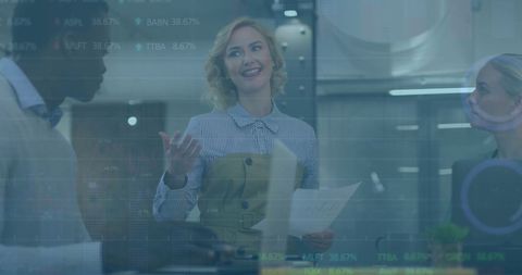 Collaborative business meeting with financial data overlay