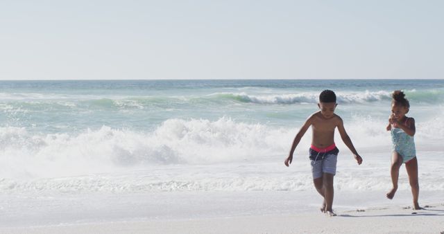 Happy Children Playing at Beach on Sunny Day - Download Free Stock Images Pikwizard.com