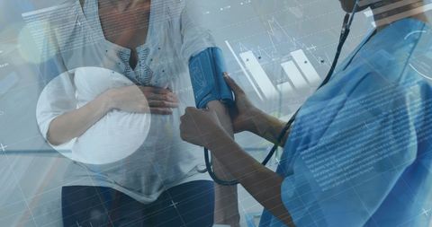 Pregnant Woman Receiving Blood Pressure Check by Doctor