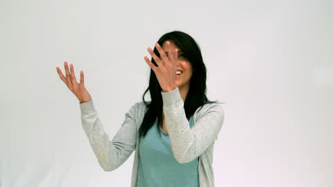 Woman Tossing Globe with Joyful Expression