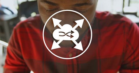 Focused man in plaid shirt studying with cloud connectivity symbol