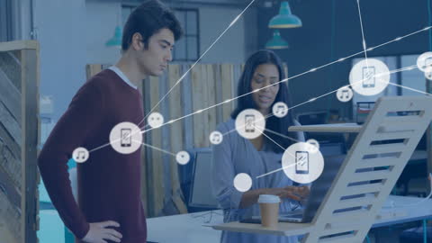 Diverse Colleagues Discussing Innovative Digital Networks in Modern Office