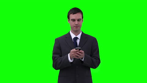 Businessman Texting on Smartphone with Green Screen Background