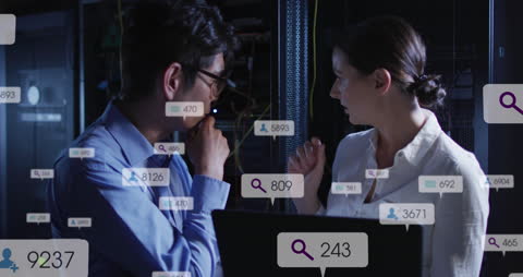 Engineers Analyzing Data with Social Media Interface in Server Room