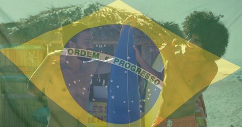 Carrying blue surfboard on sunny brazilian beach with flag overlay, friends celebrating