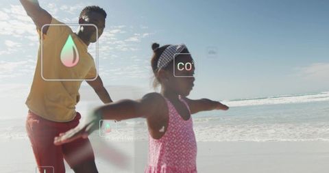 Parent and child balancing on sunny beach with augmented co2 and environmental overlays