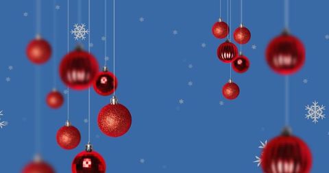 Festive Red Baubles and Snowflakes on Blue Background