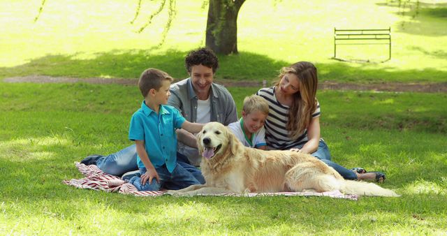 Family bonding with two children and friendly dog on sunny day in park. Perfect for themes of family time, leisure, summer, happiness, and pet love.