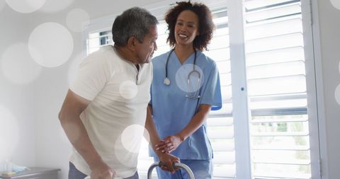 Senior Man with Doctor Using Walker Indoors