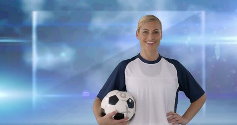 Confident Female Athlete Holding Soccer Ball in Dynamic Sports Setting - Download Free Stock Images Pikwizard.com