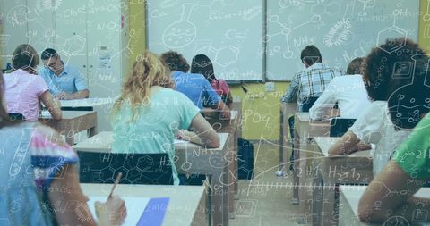 Students in Classroom Studying Chemisty Equations