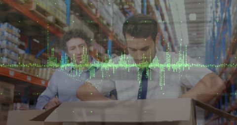Warehouse Workers Analyzing Boxes with Digital Finance Overlay
