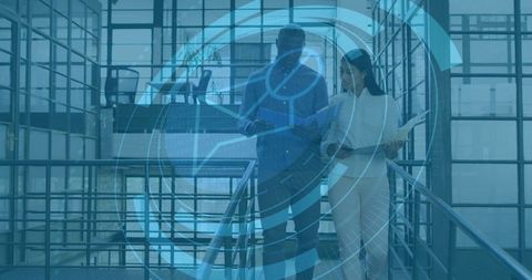Business professionals reviewing tablet and folder on glass atrium stairs with HUD overlay