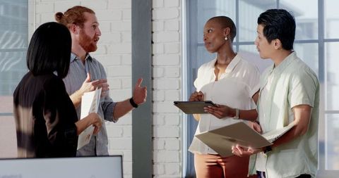 Diverse Team Brainstorming Project in Modern Office Setting