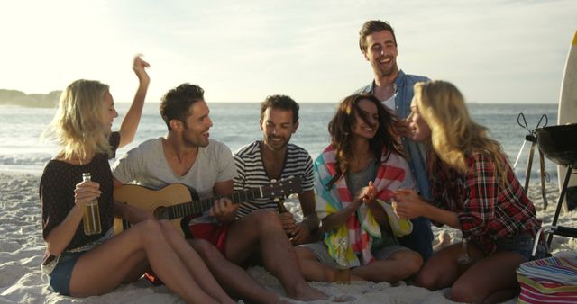 Group of Friends Enjoying Music on Beach at Sunset - Download Free Stock Images Pikwizard.com