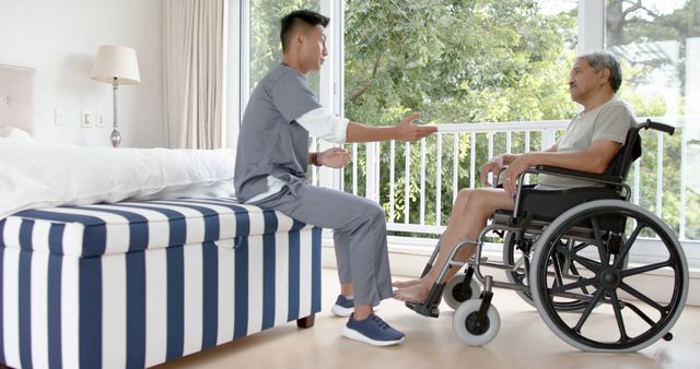 Caregiver Assisting a Senior Man in a Wheelchair - Download Free Stock Images Pikwizard.com