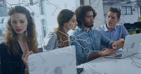 Team Collaborating with Digital Network Concept in Modern Office